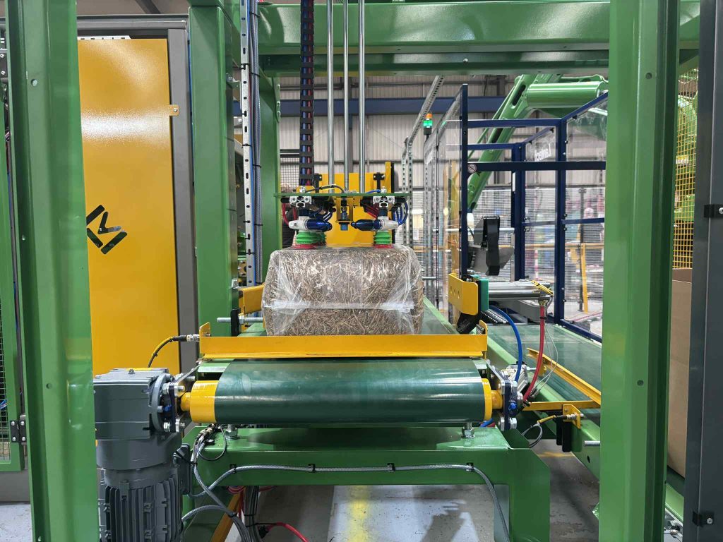 box & seal pet pack being picked up by the robot suction head ready to be put in a box.